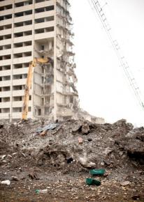 A tower of Cabrini Green in the midst of demolition